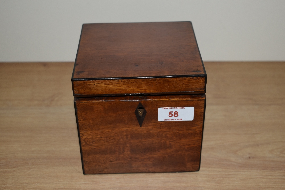 A late 18th/early 19th Century Sheraton period tea caddy, ebony banded, and opening to a fitted