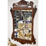 A 19thearly 20th century fret-framed Chippendale style wall mirror.