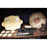 Two vintage wooden trays, one having red and gold motifs and the other with foliate decoration, an