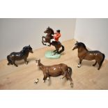 A Beswick Pottery Huntsman on Rearing Horse, model number 868, style two, designed by Arthur