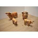 Two Beswick Pottery Highland Bulls, model number 2008 in tan/brown gloss, together with two