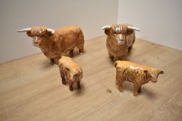 Two Beswick Pottery Highland Bulls, model number 2008 in tan/brown gloss, together with two