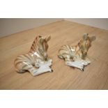 A pair of USSR Russian Lomonosov porcelain animal figures, formed as zebra foals laying down, one