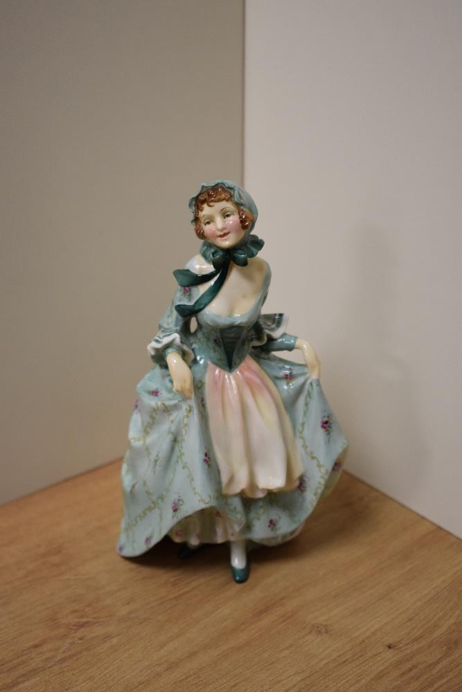 A Royal Doulton bone china figurine 'Suzette' HN1696, 19cm with green dress and peach tinted apron