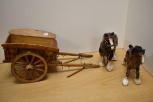 Two Beswick pottery style horses, with large pine trap having brass bound wheels