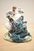 A Royal Doulton bone china figure group 'St George' HN2051, St George modelled slaying the dragon,