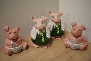 A group of four Wade Natwest piggy money banks, comprising two Woody and two Annabel, each with