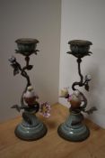 A pair of attractive cast gilt metal and porcelain garniture candlesticks, formed as blossoming