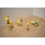 A group of four 1950's/60's cast-plastic Babysham advertising deer figures,