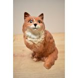 A Beswick Pottery Persian Cat study, seated looking up, number 1867, designed by Albert Hallam in