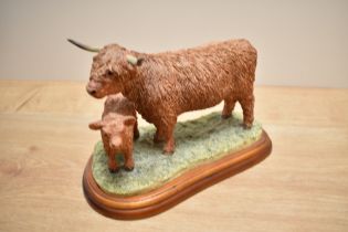 A Border Fine Arts Highland Cow and Calf study, on moulded mahogany plinth, lacking label to base
