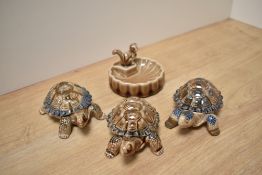A group of three Wade porcelain tortoise form trinket boxes, together with a scalloped circular