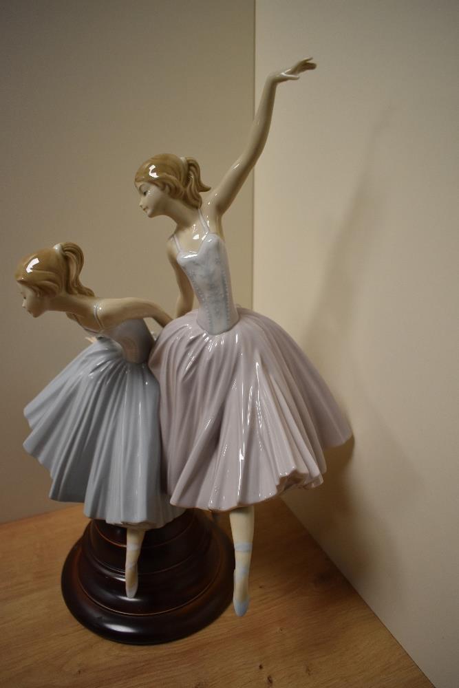 A large and Lladro porcelain figural group, 'Merry Ballet' formed as two ballerinas, one mid-jump, - Image 2 of 4