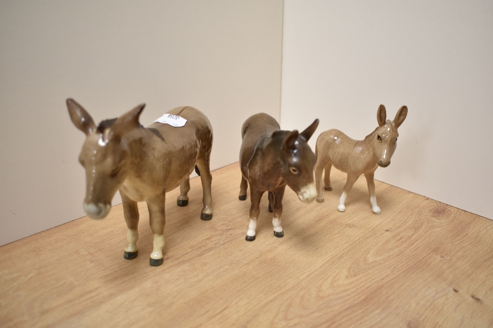 A group of three Beswick Pottery Donkey studies, comprising 'Donkey' 2267A designed by Albert Hallam