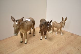 A group of three Beswick Pottery Donkey studies, comprising 'Donkey' 2267A designed by Albert Hallam
