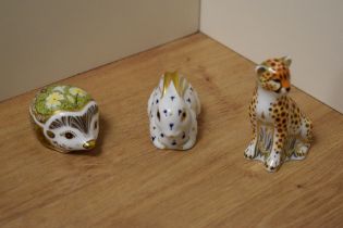 A group of three Royal Crown Derby Imari style paperweights, formed as a Hedgehog and Cheetah,