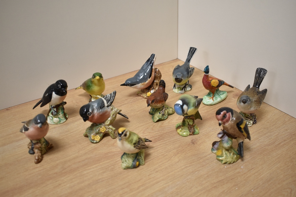 A group of twelve Beswick Pottery bird studies, comprising Stonechat 2274, Grey Wagtail 1041,