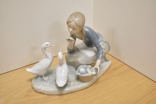 Lladro 'Food for Ducks' 4849 porcelain figure group, having printed mark to base, 18cm tall.