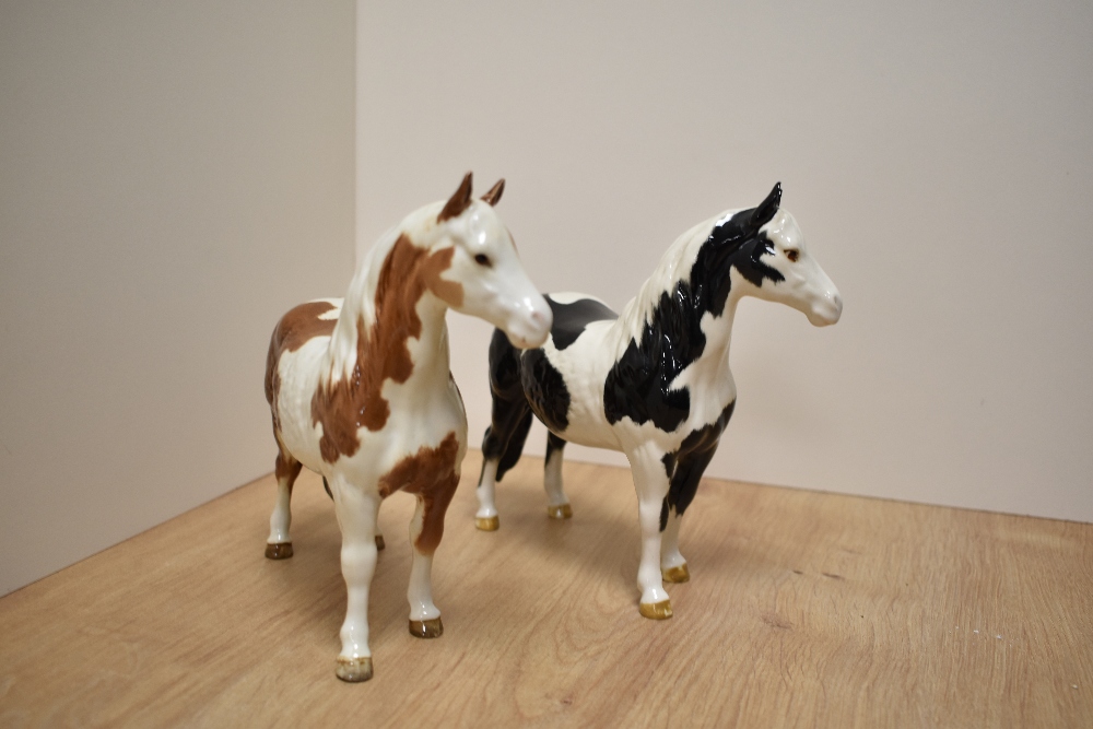 Two Beswick Pottery Pinto Ponies, comprising Skewbald first version and Piebald second version, - Image 2 of 4