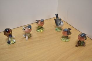 A group of six Beswick Pottery bird figures, comprising Goldfinch 2273, Chaffinch 991 x4 and wren