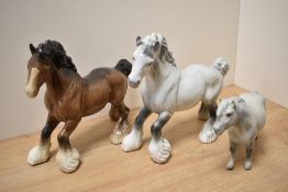 Two Beswick Pottery 'Cantering Shire' horse studies, number 975 designed by Arthur Gredington in