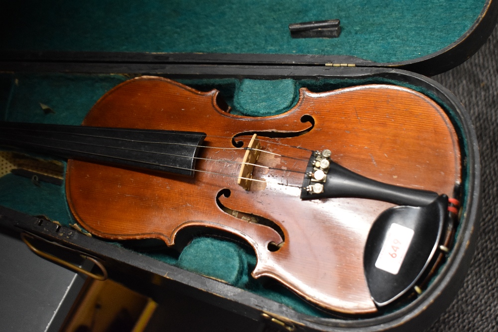 A traditional violin having 13 inch two piece back, with hard case, with printed label J G