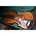 A traditional violin having 13 inch two piece back, with hard case, with printed label J G