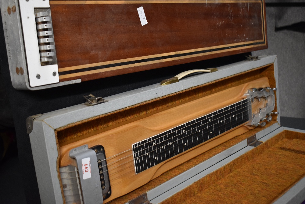 A vintage lap slide guitar and similar part