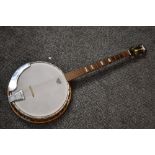 A vintage Kay four string banjo