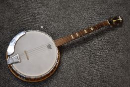 A vintage Kay four string banjo
