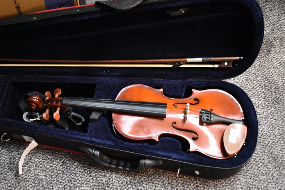 A modern violin having 13inch one piece back with fitted case and bow