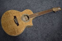 An Ibanez 12 string electro acoustic guitar, in quilted maple, model EW2012 ASENT, no case