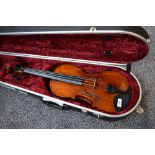 A modern violin having 4inch one piece back , unlabelled, with Hiscox fitted case