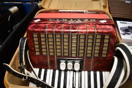 A Delicia Junior accordion , with case