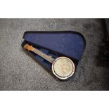 A vintage Keech Banjolele, stamped serial number B 10461, open back with signature to back