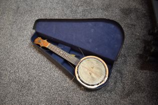 A vintage Keech Banjolele, stamped serial number B 10461, open back with signature to back