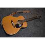 A vintage Fender F-25 acoustic guitar