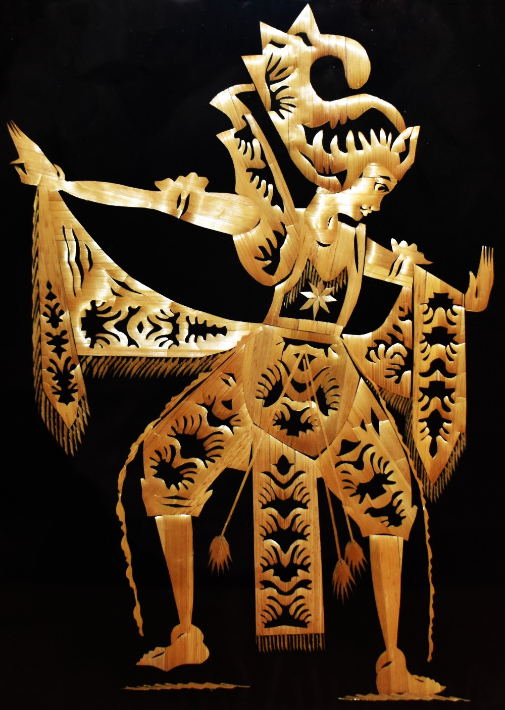 20th Century Indonesian School, straw marquetry, A pair of figural panels on black cotton canvas