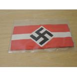 A German WWII cloth Armband, red and white with black Swastika