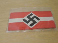 A German WWII cloth Armband, red and white with black Swastika