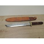 A modern Bowie Knife, no makers marks seen, wood grip, blade inscribed Remember The Alamo 1836 The
