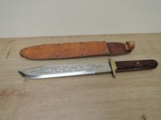 A modern Bowie Knife, no makers marks seen, wood grip, blade inscribed Remember The Alamo 1836 The