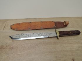 A modern Bowie Knife, no makers marks seen, wood grip, blade inscribed Remember The Alamo 1836 The