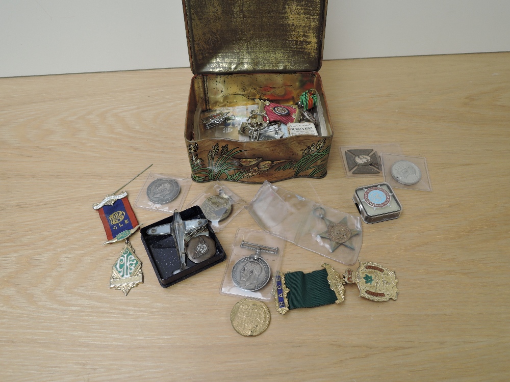 A collection of Badges and Medals, badges include AFS & NFS Kings, AA American Aircore Medallion,