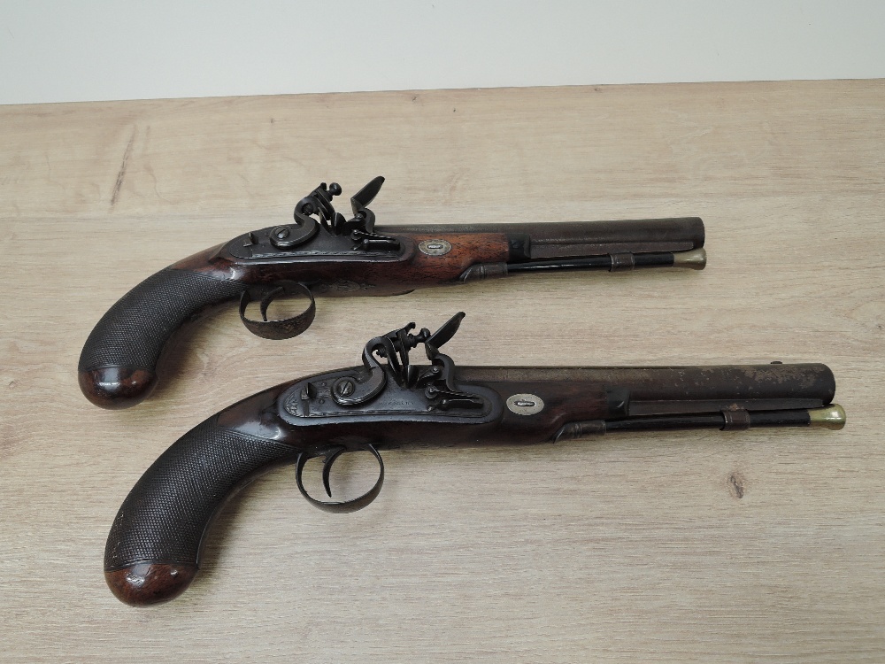 A pair of Flintlock Pistols, possibly duelling pistols, both by W Smart, identical proof marks to