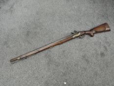 A Single Barrel Flintlock Musket with ram rod, possible reproduction or restored/made up, marked
