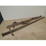 A Sudanese Kaskara Sword having highly decorated blade with Arabic script, wooden grip with