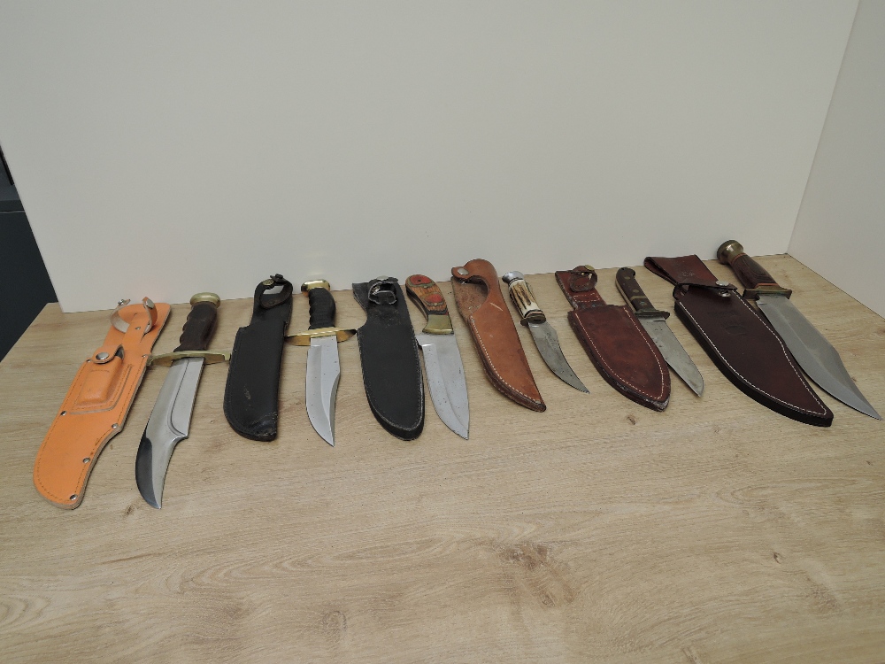 Six modern Bowie Knives all with leather scabbards including German, Pakistan, Japanese, Herbert