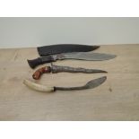 A Gurkha Kukri with wood handle and leather scabbard, blade length 32cm, overall length 42cm,
