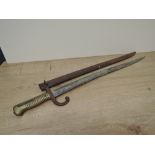 A 1866 French Sword Bayonet for the Chassepot Rifle with metal scabbard, blade length 57cm,